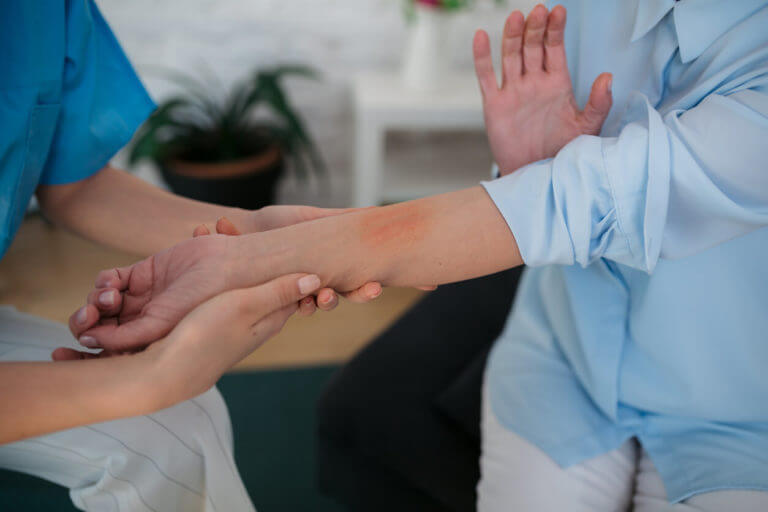 Medical staff giving eczema treatment